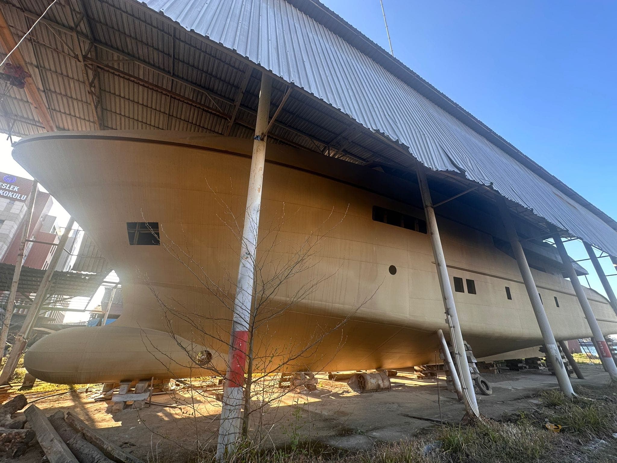 The PTTRA 42.5m hull under the yard shed