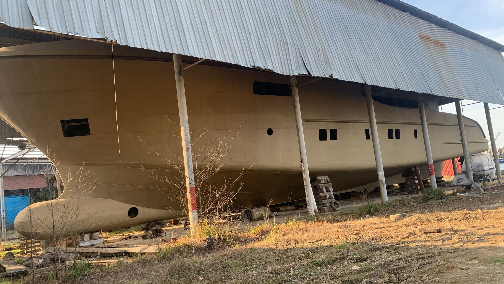 The steel hull of PTTRA 42.5m under the yard shed